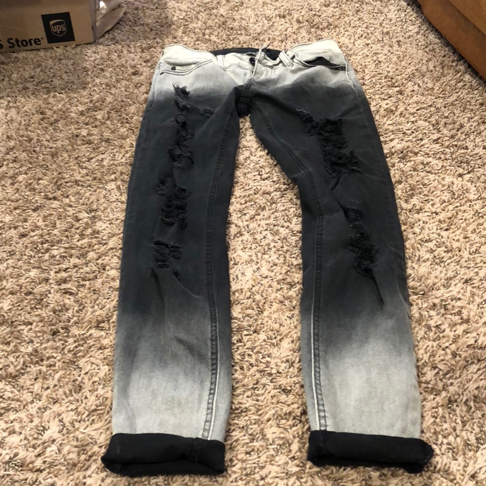 Black and white faded jeans